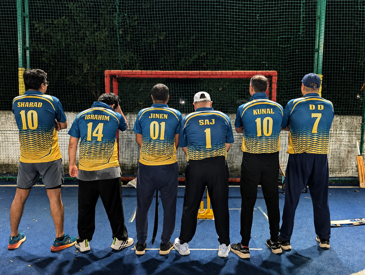 Entrepot Royals players displaying their names and jersey numbers