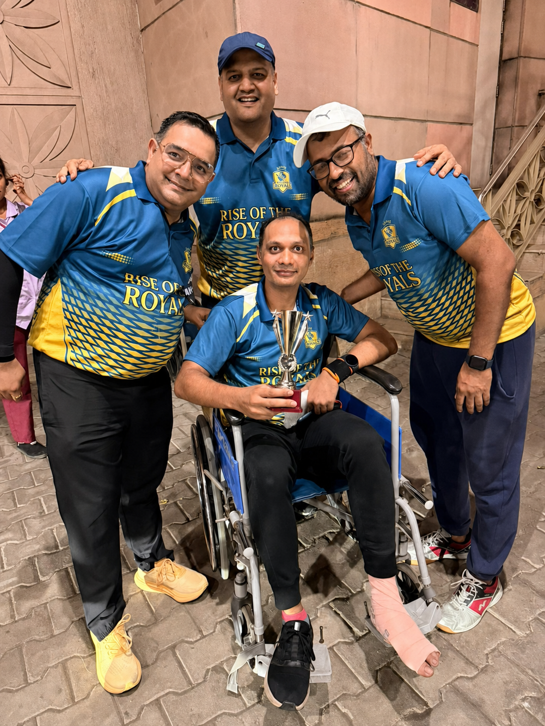 Entrepot Royals players celebrating together with a trophy